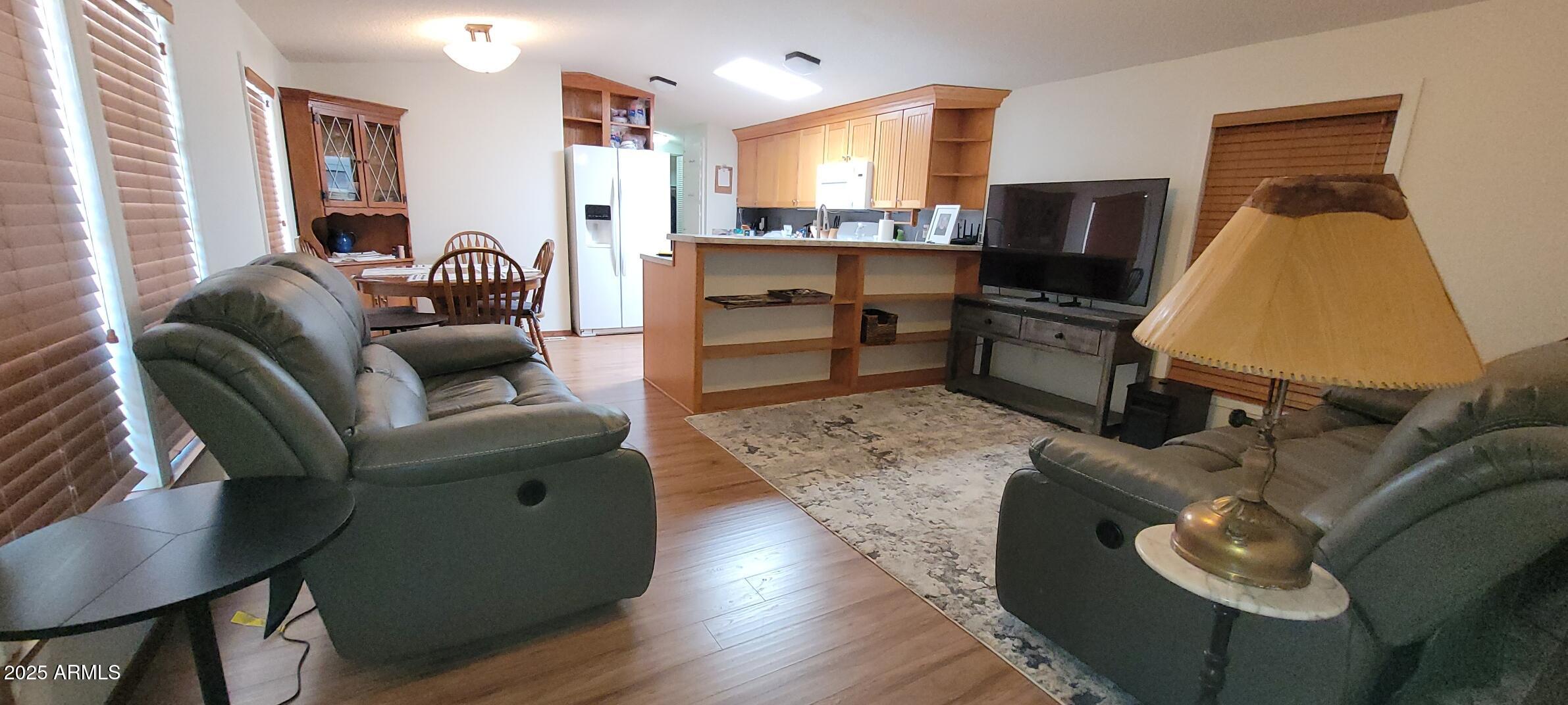 30850 South Vagabond Trail, Unit 87 Congress, AZ 85332 - Photo 3 of 19 a living room with furniture and a flat screen tv