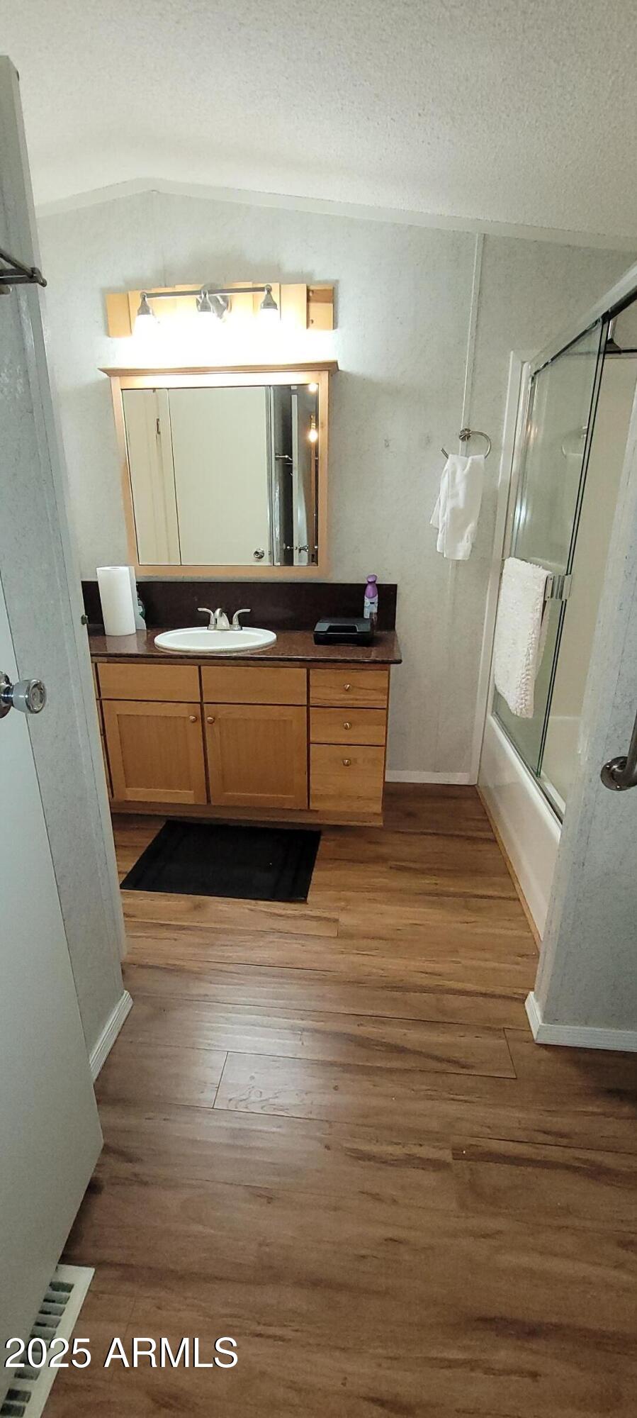 30850 South Vagabond Trail, Unit 87 Congress, AZ 85332 - Photo 7 of 19 a living room with furniture and a wooden floor