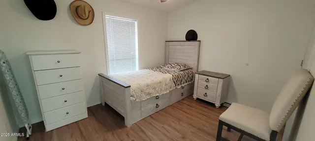 a bedroom with a bed and a dresser