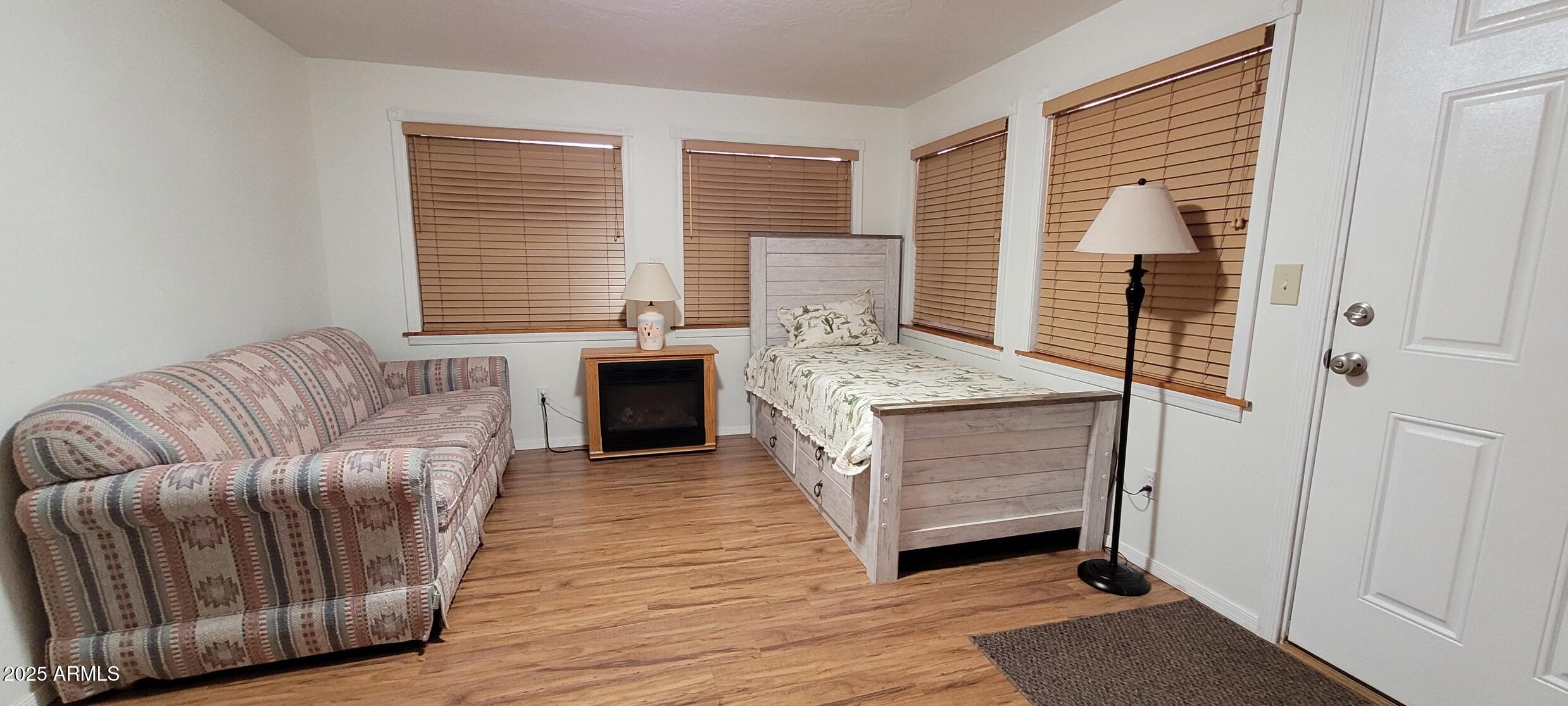 30850 South Vagabond Trail, Unit 87 Congress, AZ 85332 - Photo 10 of 19 a living room with furniture and a fireplace