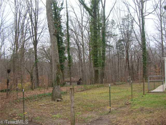1460 Mizpah Church Road Rural Hall, NC 27045 - Photo 3 of 16 Land. Fenced area directly behind home offers a Great place for a garden or for animal.