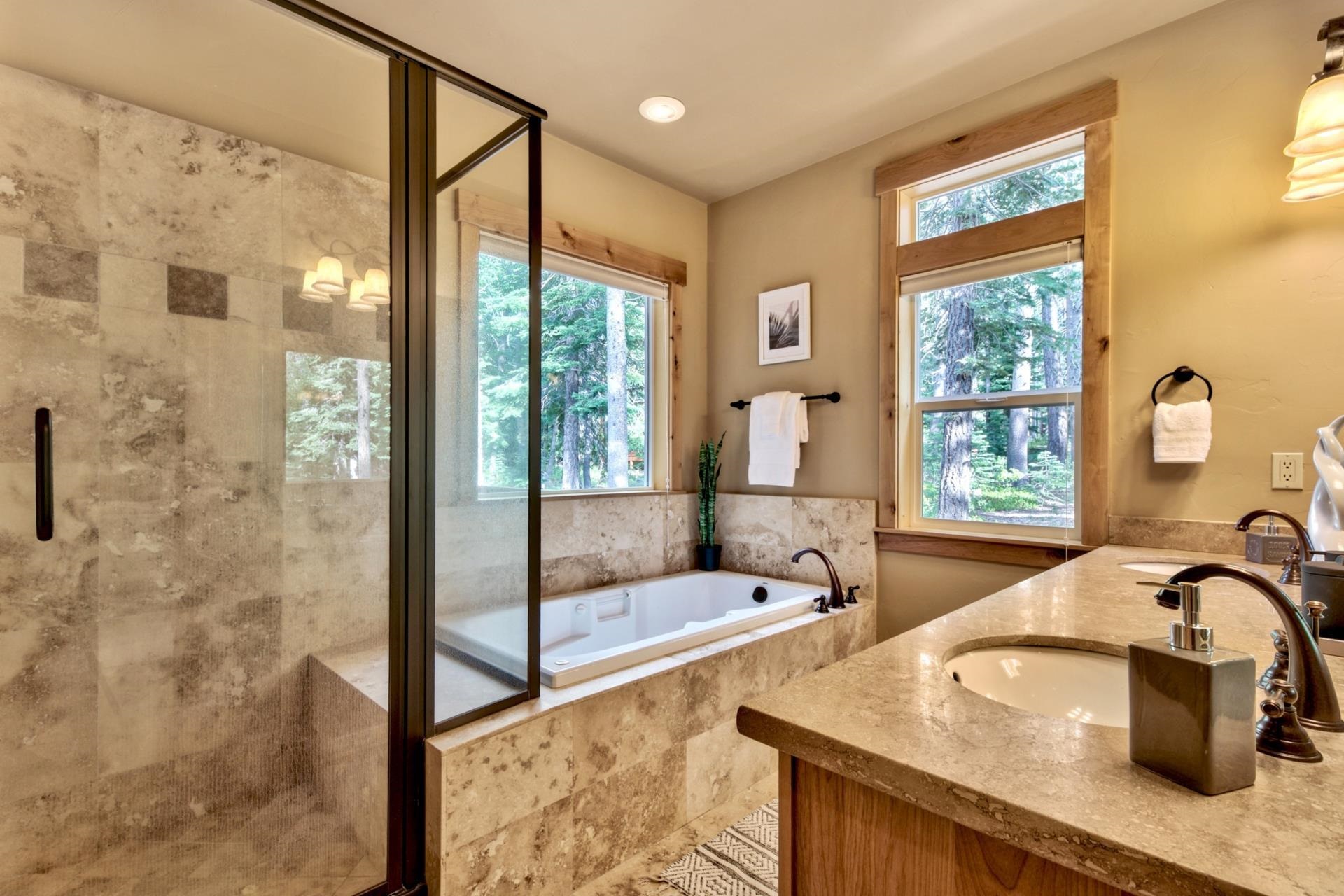 14121 Swiss Lane Truckee, CA 96161 - Photo 15 of 21 a bathroom with a tub sink and mirror