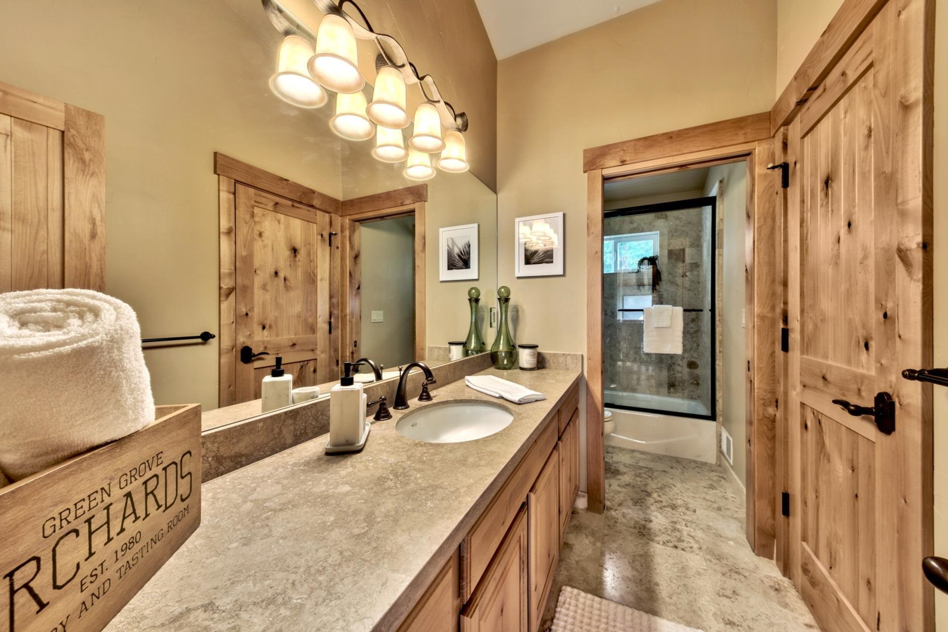 14121 Swiss Lane Truckee, CA 96161 - Photo 17 of 21 a spacious bathroom with sinks mirror and a shower