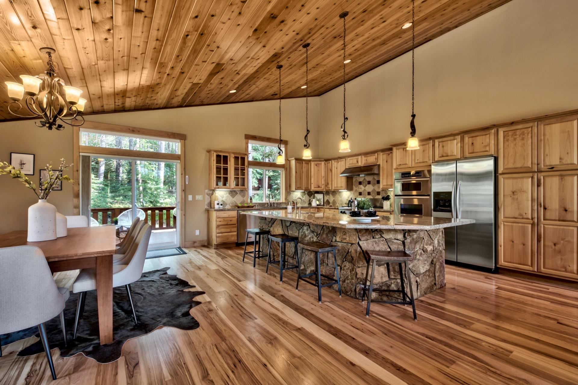 14121 Swiss Lane Truckee, CA 96161 - Photo 7 of 21 a view of a dining room with furniture window and wooden floor