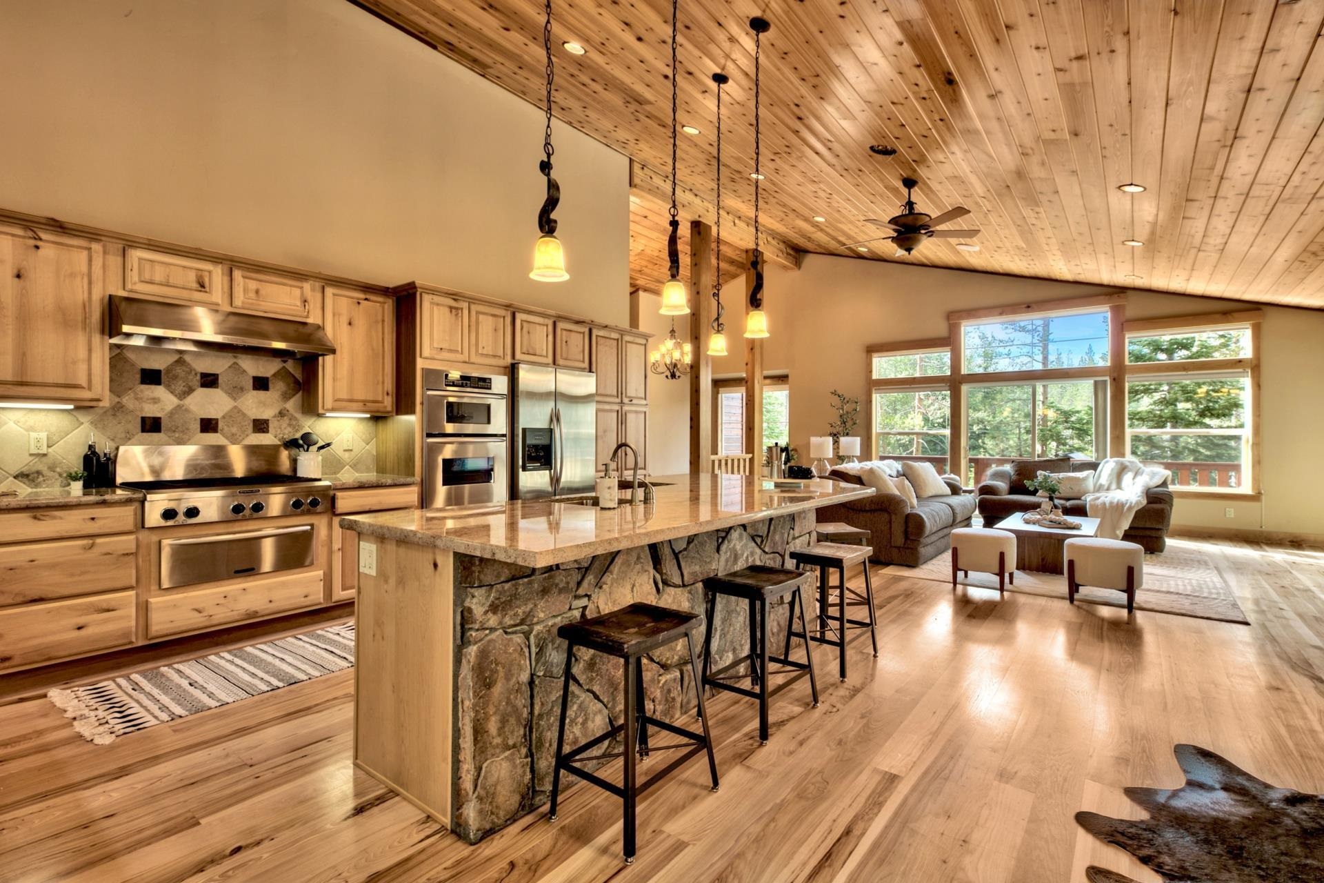 14121 Swiss Lane Truckee, CA 96161 - Photo 10 of 21 a large kitchen with a table and chairs in it