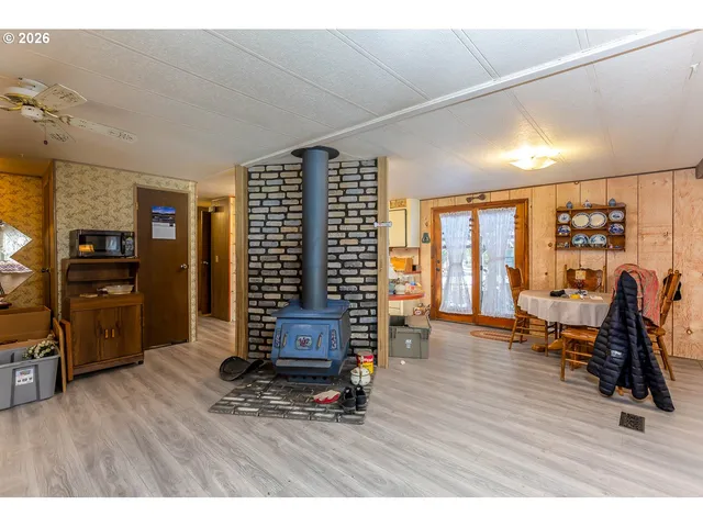 a kitchen filled with stainless steel appliances kitchen island granite countertop a stove and cabinets