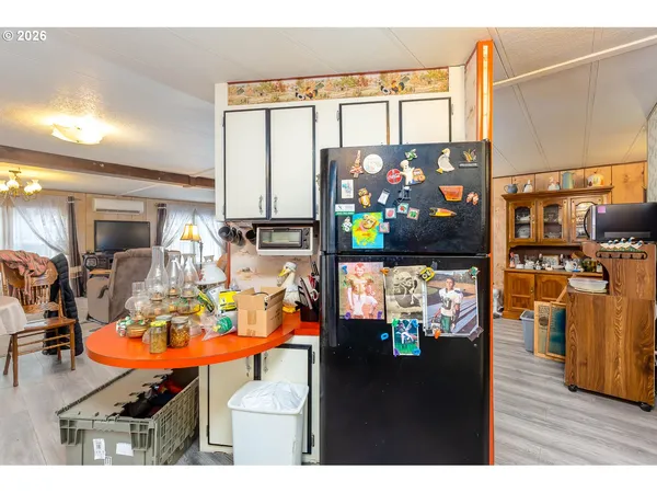 a bed room with a bed and a chandelier