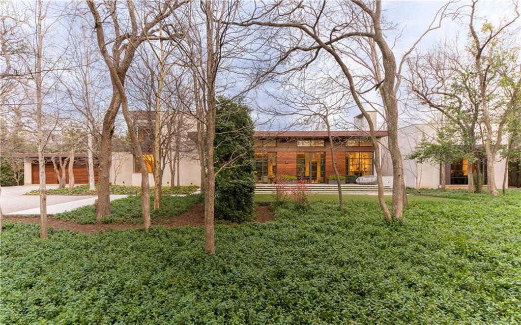 a backyard of a house with lots of green space