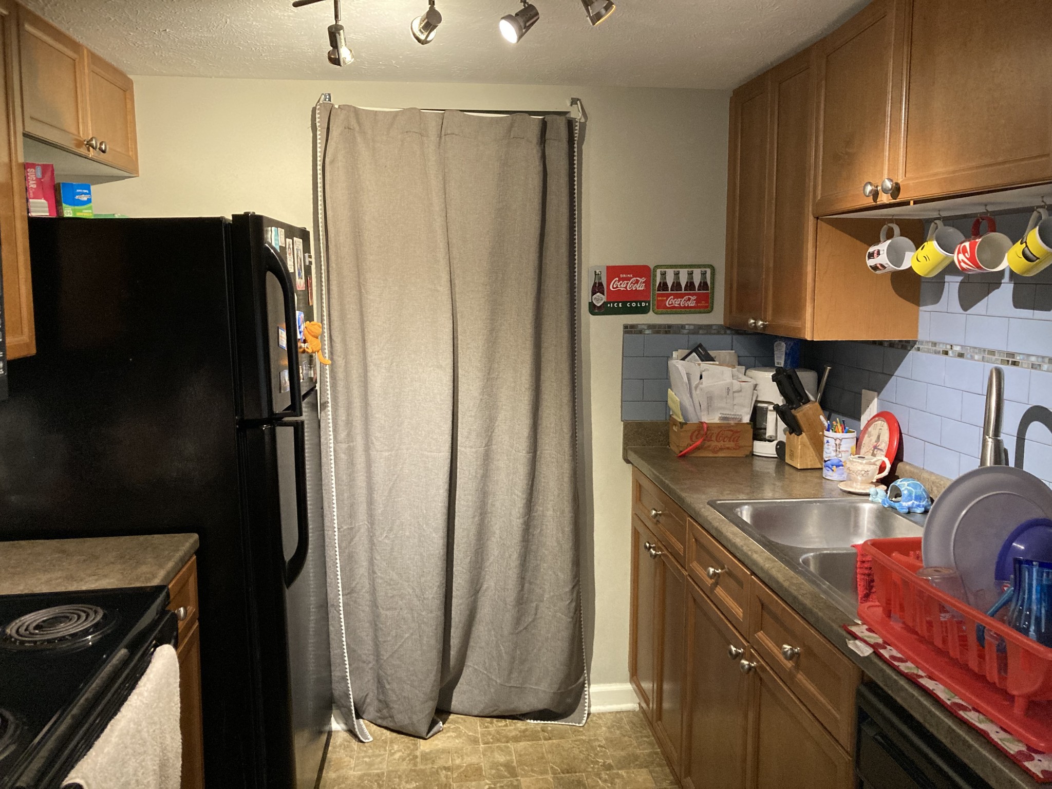 420 Elysian Fields Road, Unit E5 Nashville, TN 37211 - Photo 6 of 14 a kitchen with stainless steel appliances granite countertop a refrigerator and a sink