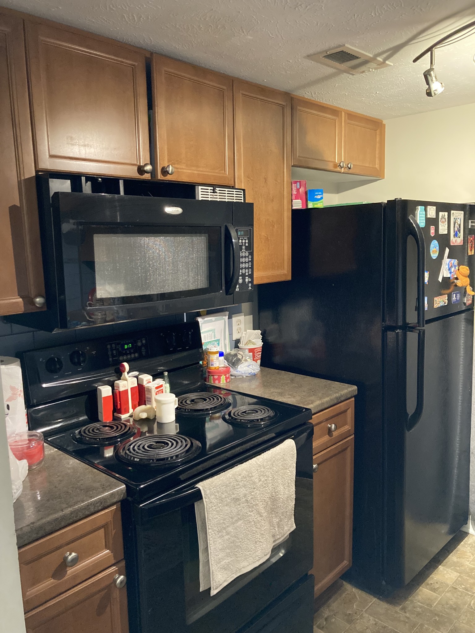 420 Elysian Fields Road, Unit E5 Nashville, TN 37211 - Photo 8 of 14 a kitchen with stainless steel appliances granite countertop a stove and a microwave