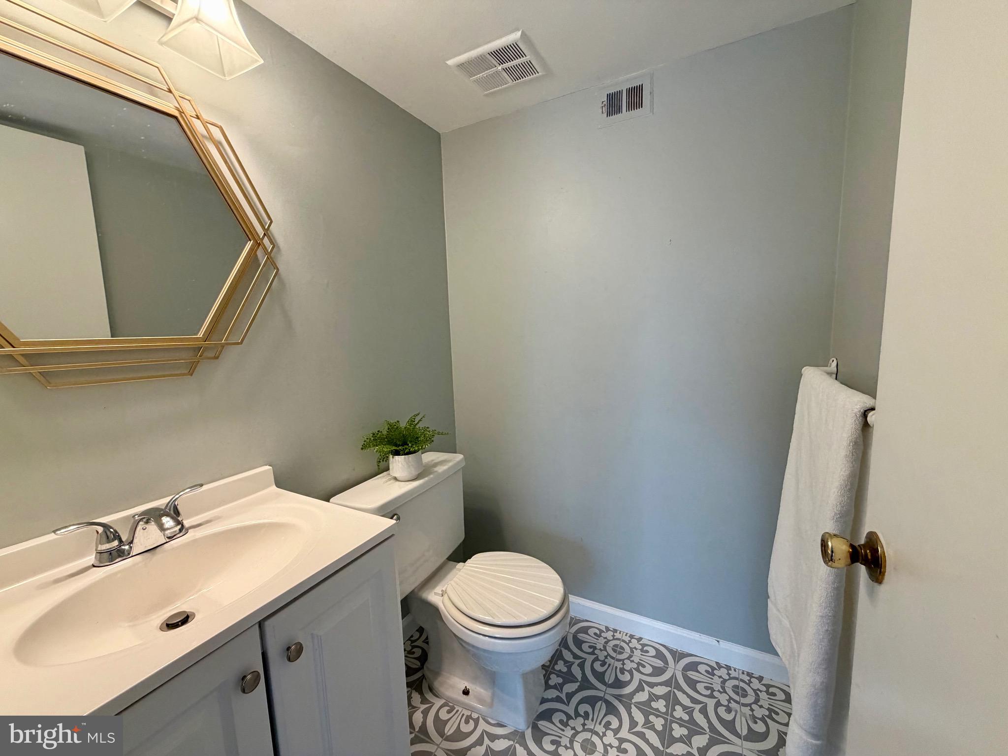 33 Georgetown Road Lindenwold, NJ 08021 - Photo 12 of 27 a bathroom with a sink and a toilet