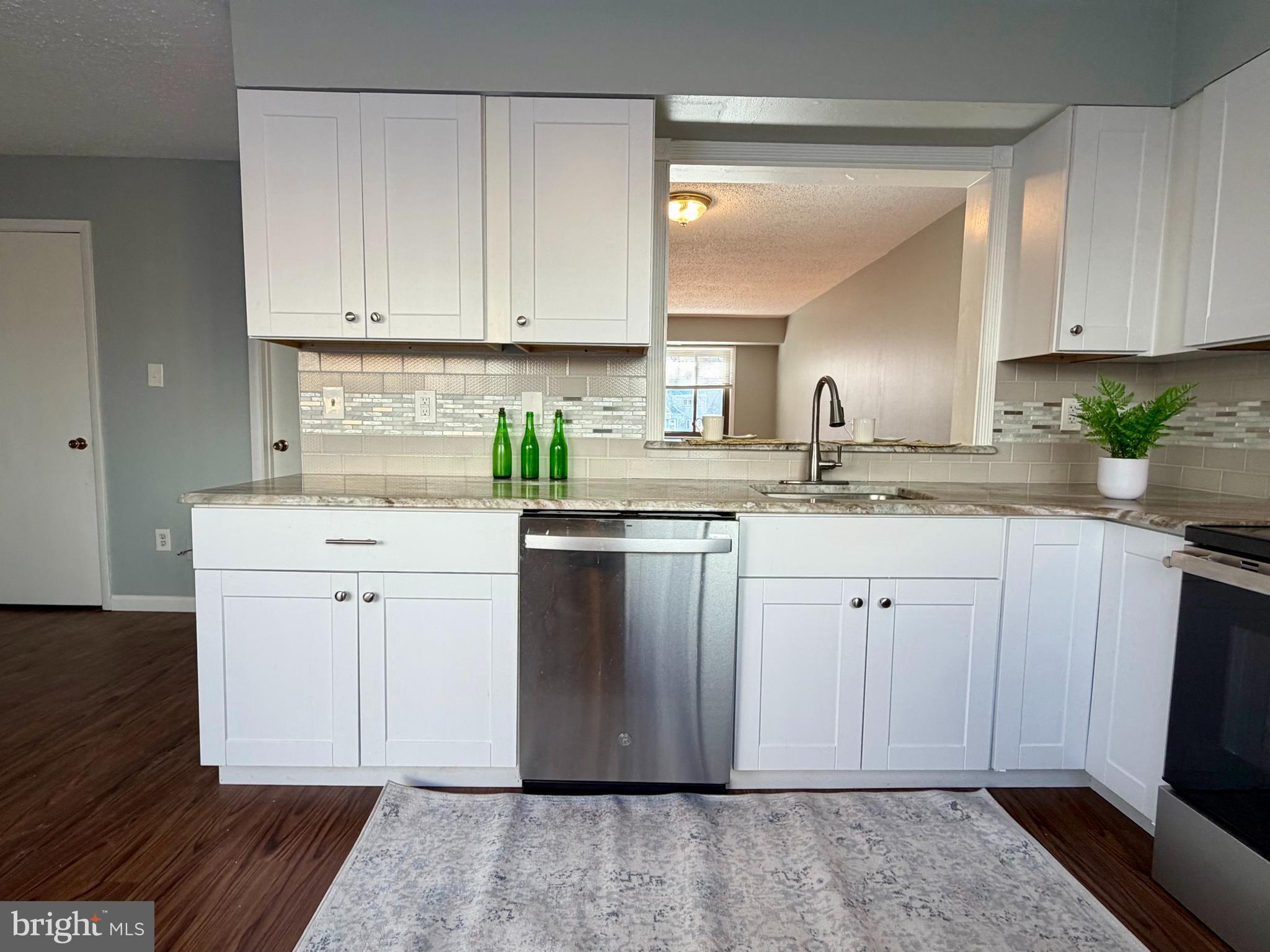33 Georgetown Road Lindenwold, NJ 08021 - Photo 14 of 27 a kitchen with white cabinets appliances and a sink