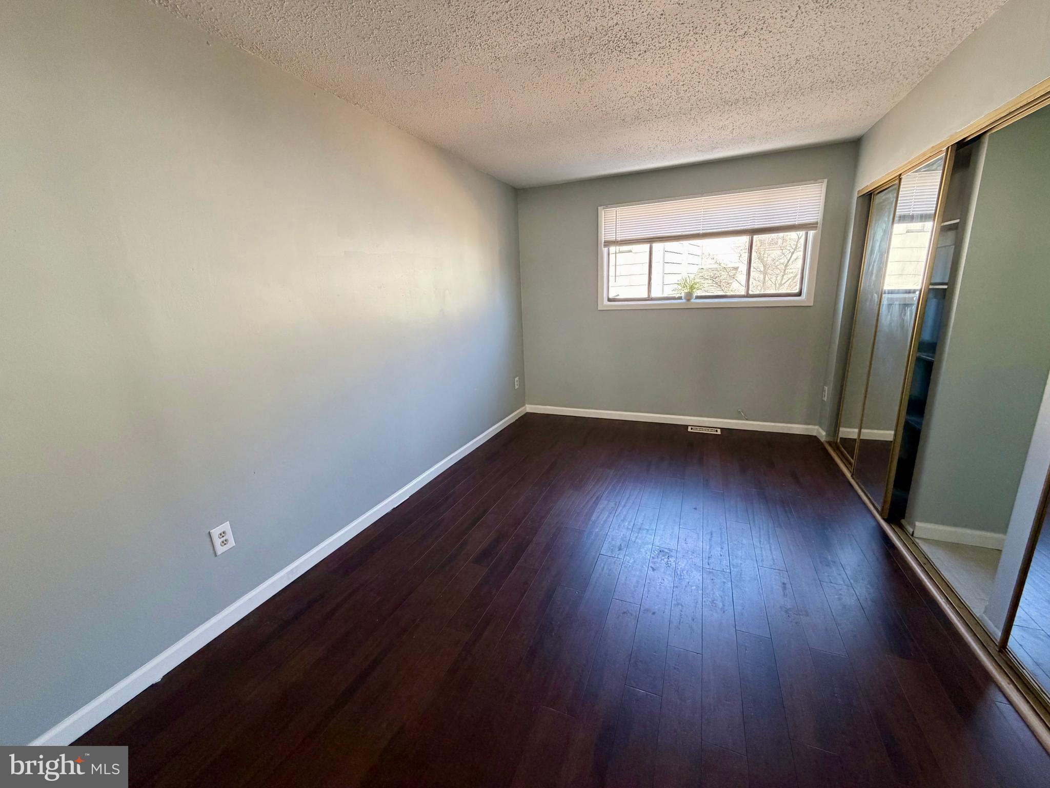 33 Georgetown Road Lindenwold, NJ 08021 - Photo 19 of 27 an empty room with wooden floor and windows