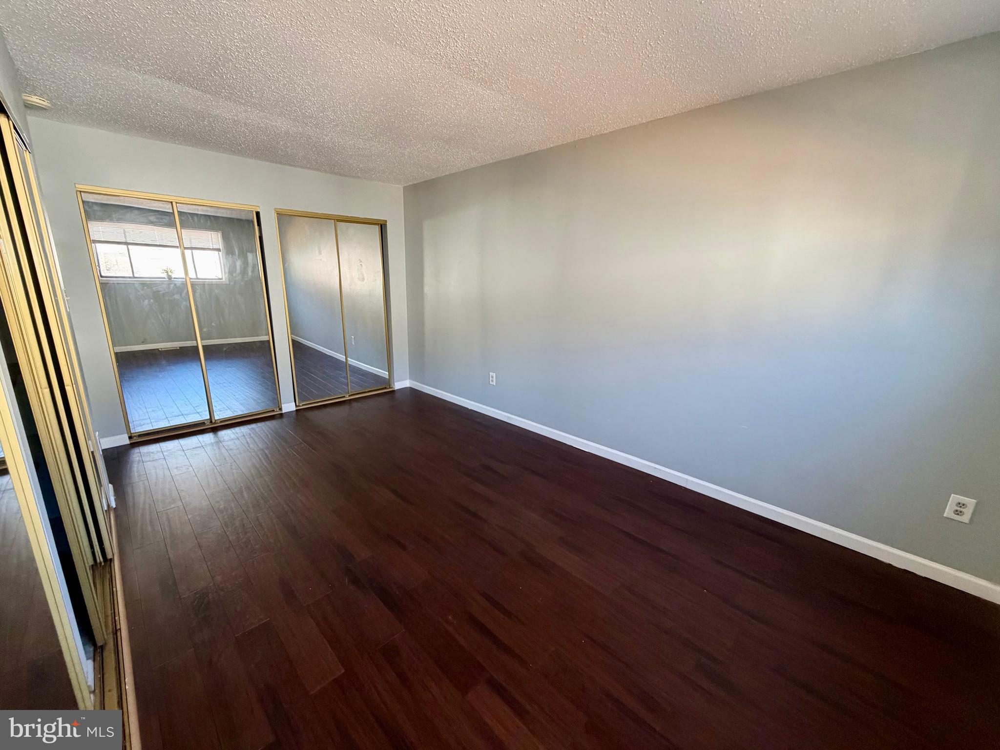 33 Georgetown Road Lindenwold, NJ 08021 - Photo 20 of 27 an empty room with wooden floor and sliding door