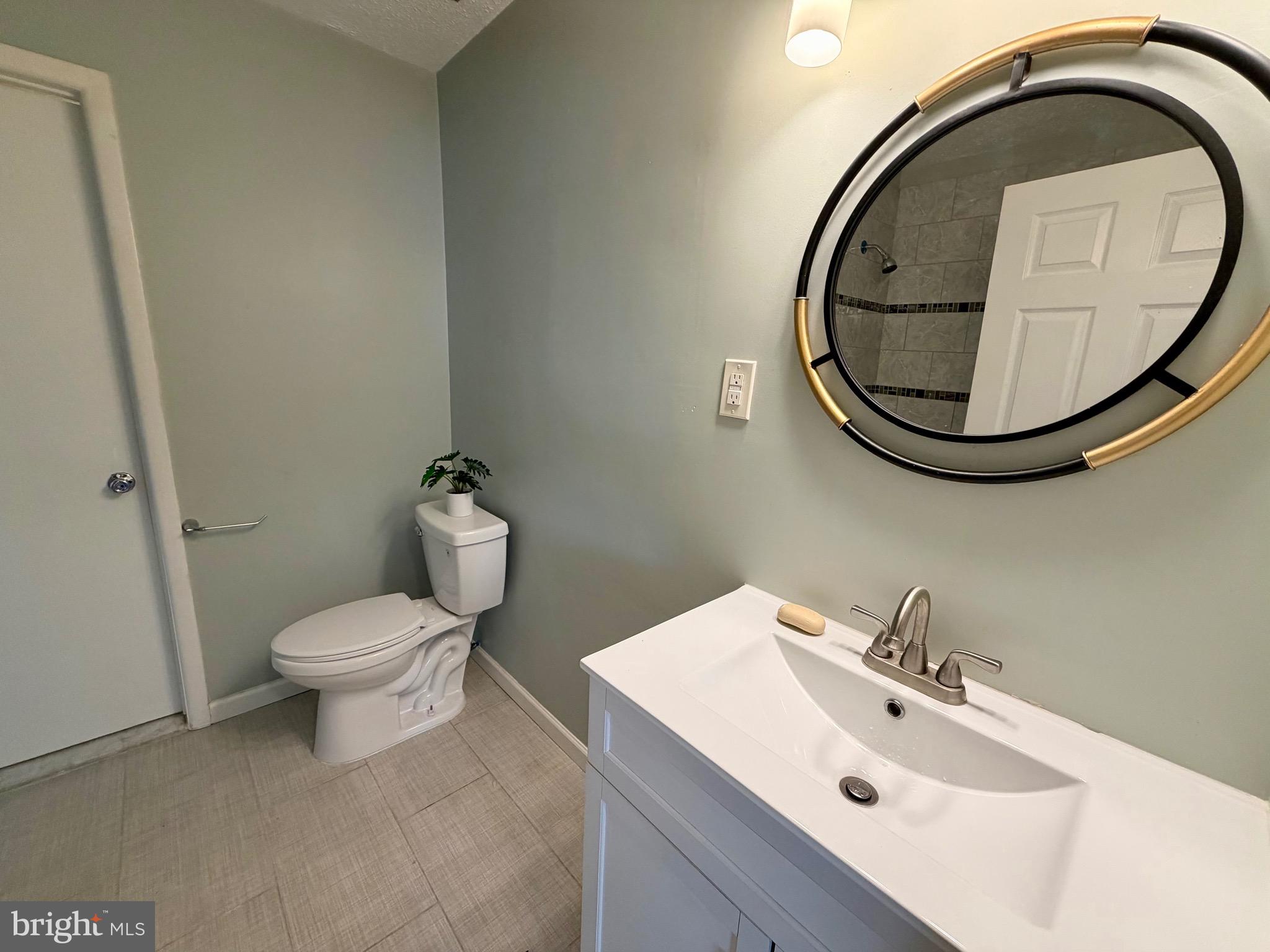33 Georgetown Road Lindenwold, NJ 08021 - Photo 23 of 27 a bathroom with a sink and a mirror