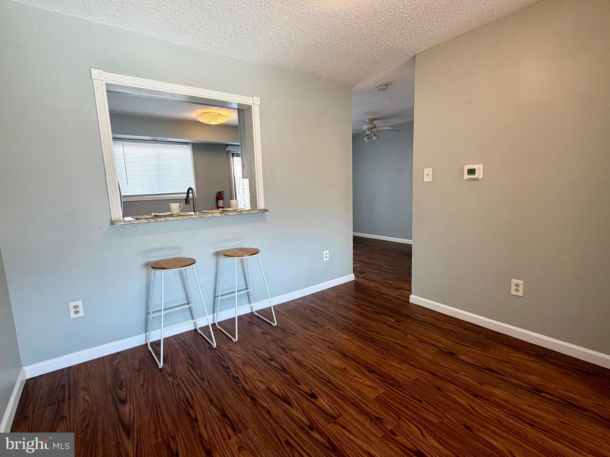 33 Georgetown Road Lindenwold, NJ 08021 - Photo 7 of 27 a view of an empty room with wooden floor and mirror