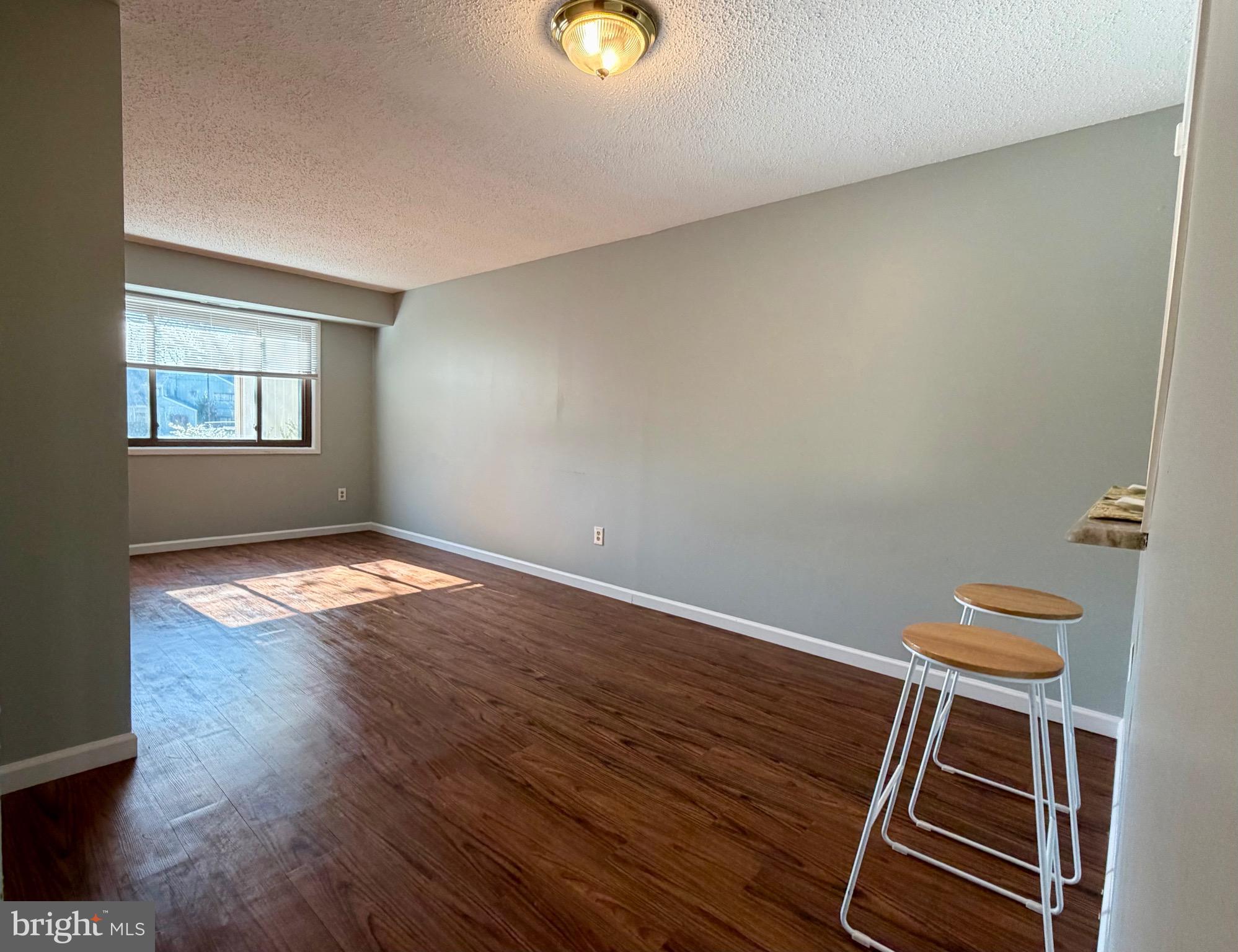 33 Georgetown Road Lindenwold, NJ 08021 - Photo 8 of 27 a view of an empty room with wooden floor and a window