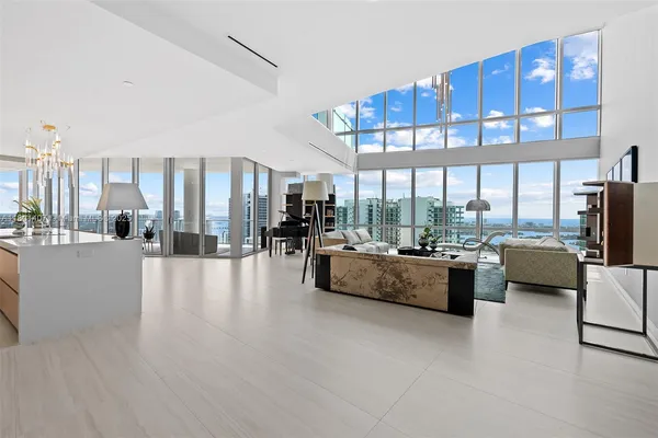 a view of a living room and a balcony