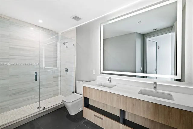 a spacious bathroom with a large tub and sink