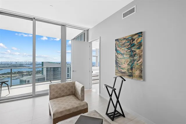a spacious bathroom with a bathtub and a sink