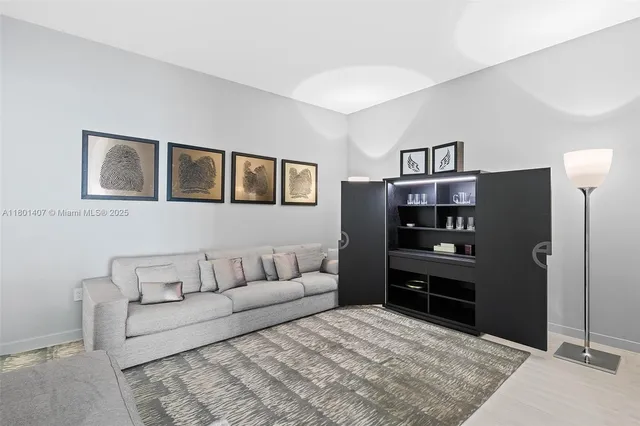 a view of a room with lots of wooden furniture