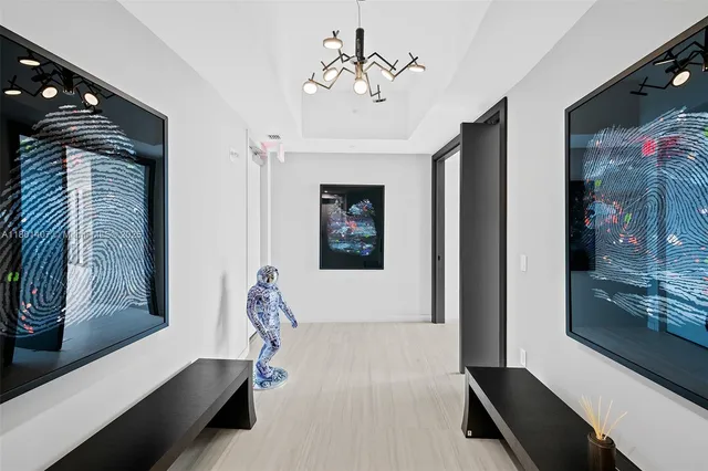 a kitchen with stainless steel appliances kitchen island a table and chairs in it
