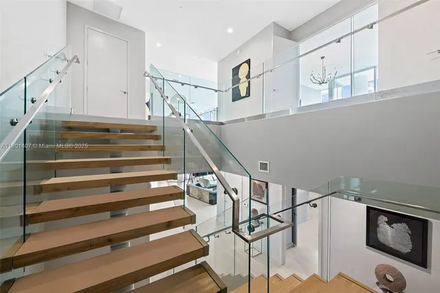 a bathroom with a double vanity sink toilet and shower