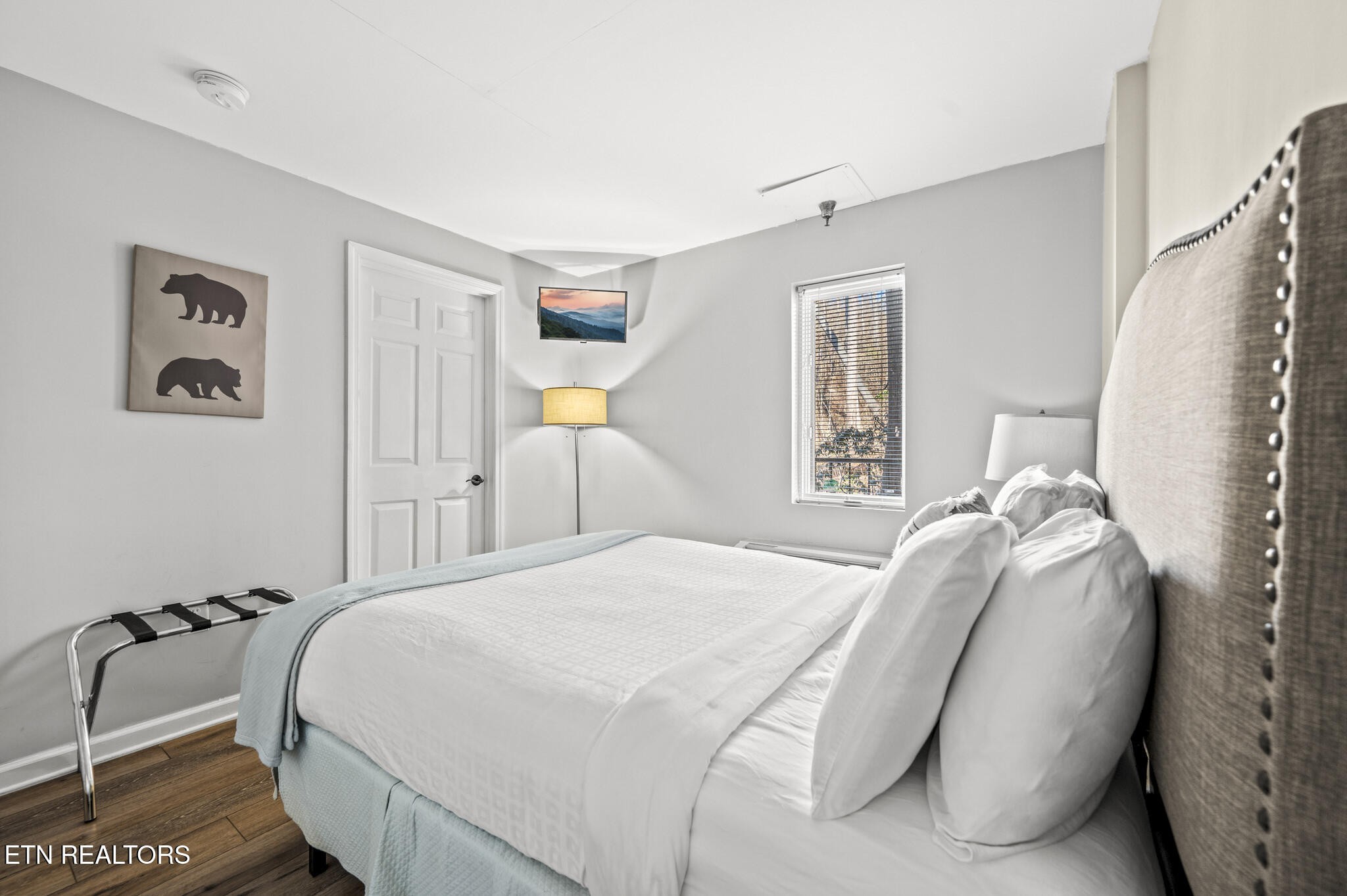 413 Baskins Creek Road, Unit 406 Gatlinburg, TN 37738 - Photo 14 of 26 a bedroom with a bed and a window