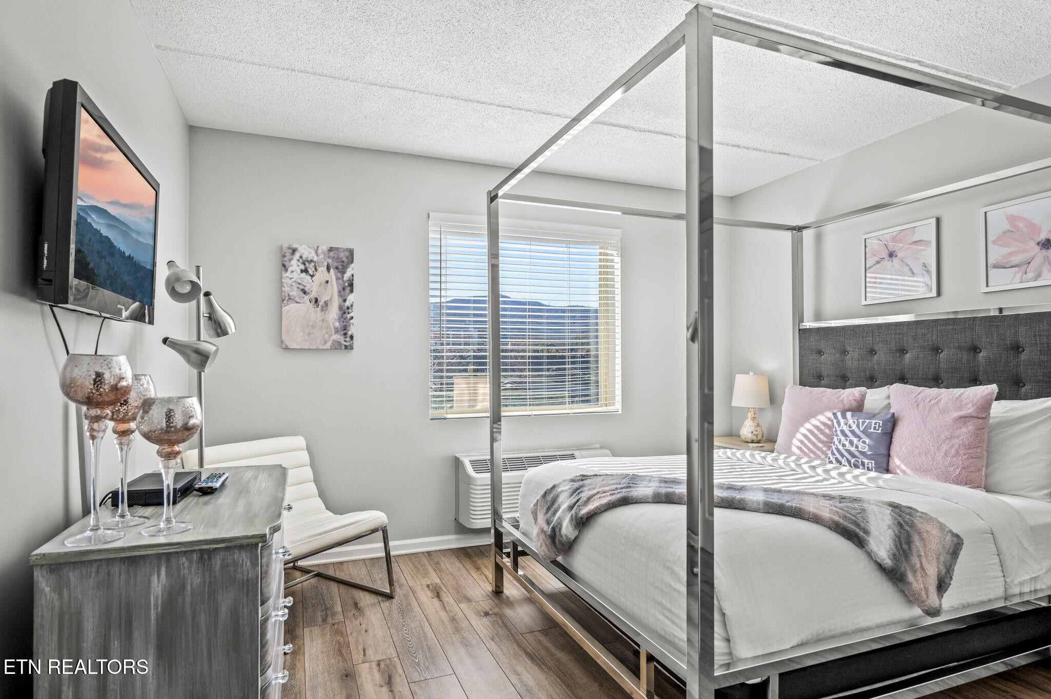 413 Baskins Creek Road, Unit 406 Gatlinburg, TN 37738 - Photo 18 of 26 a bedroom with a bed and a flat screen tv