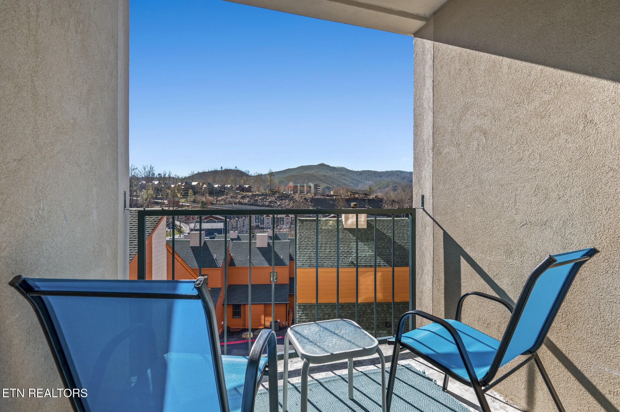 413 Baskins Creek Road, Unit 406 Gatlinburg, TN 37738 - Photo 25 of 26 a view of a balcony with furniture