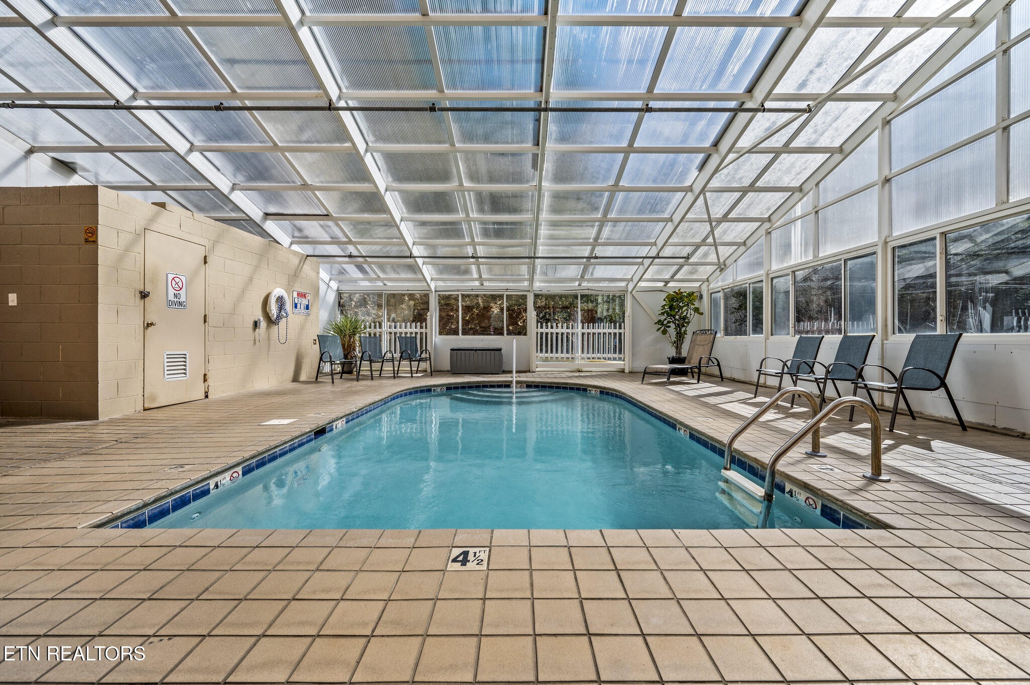 413 Baskins Creek Road, Unit 406 Gatlinburg, TN 37738 - Photo 26 of 26 a view of a swimming pool with a patio