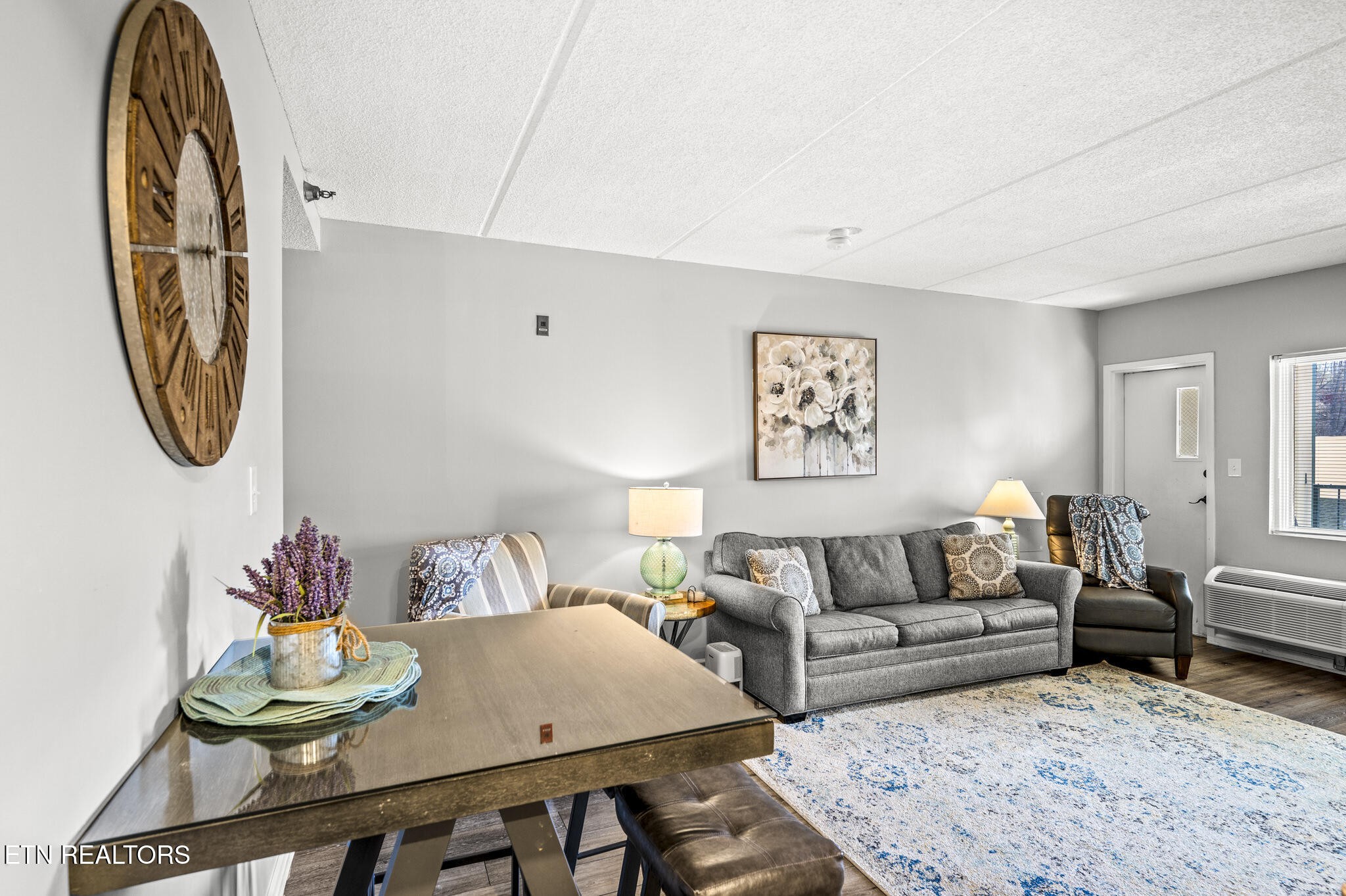 413 Baskins Creek Road, Unit 406 Gatlinburg, TN 37738 - Photo 5 of 26 a living room with furniture and a wooden floor