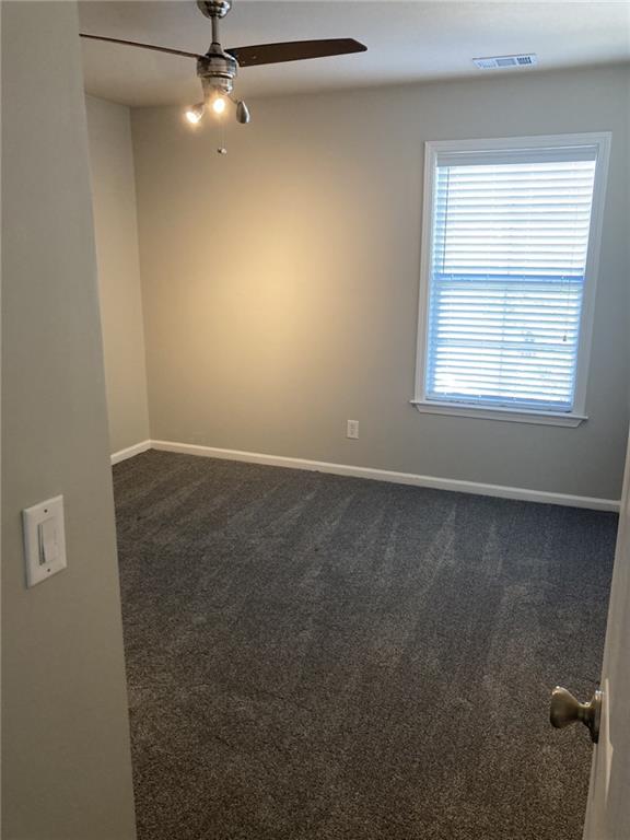 66 Godley Park Way Savannah, GA 31407 - Photo 14 of 20 an empty room with a window and a fan