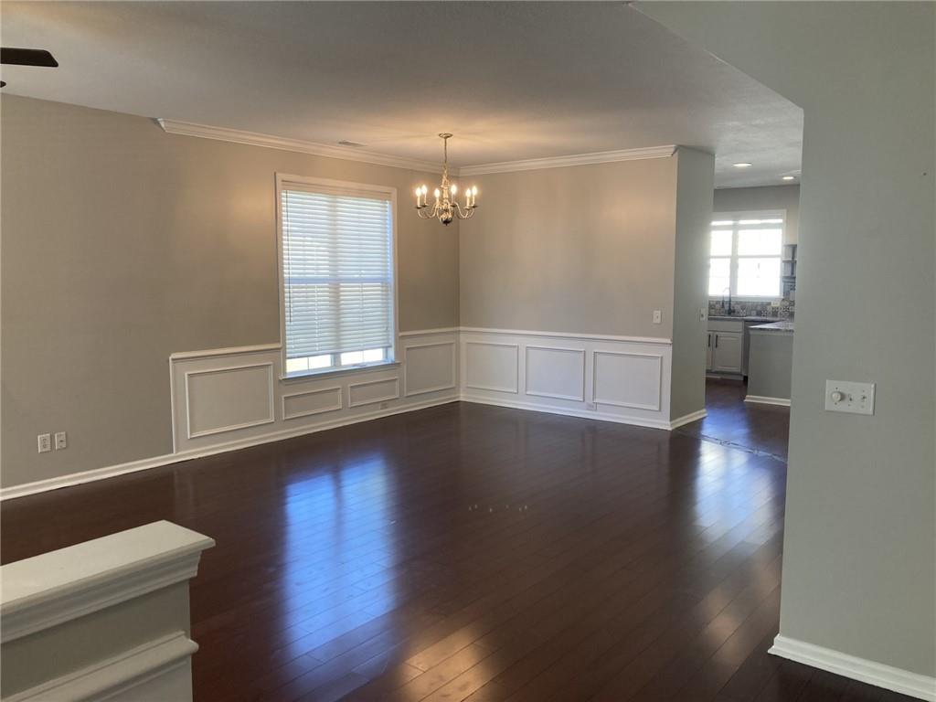66 Godley Park Way Savannah, GA 31407 - Photo 7 of 20 wooden floor in an empty room with a window
