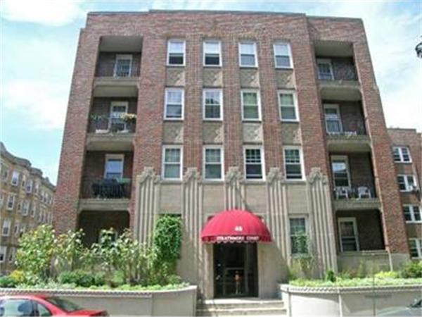 a front view of a multi story residential apartment building