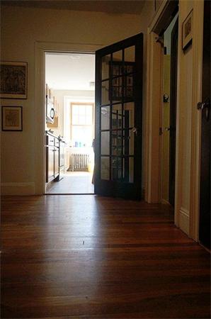 48 Strathmore Road, Unit 26 Boston, MA 02135 - Photo 6 of 10 a view of empty room with wooden floor and fan