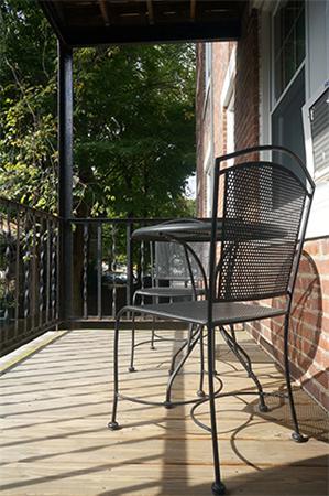 48 Strathmore Road, Unit 26 Boston, MA 02135 - Photo 10 of 10 a view of balcony with wooden floor and outdoor seating