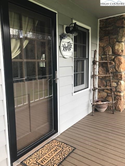 338 Riverside Drive Sparta, NC 28675 - Photo 6 of 35 a view of a door of a house with an outdoor space