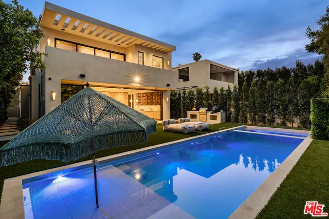 a front view of house with yard and outdoor seating