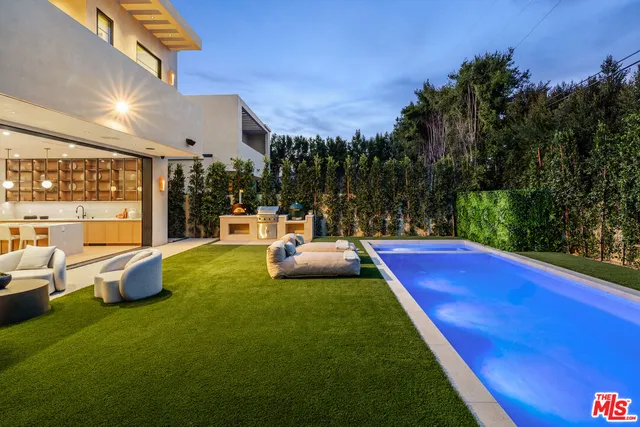 a view of a patio with swimming pool of the house