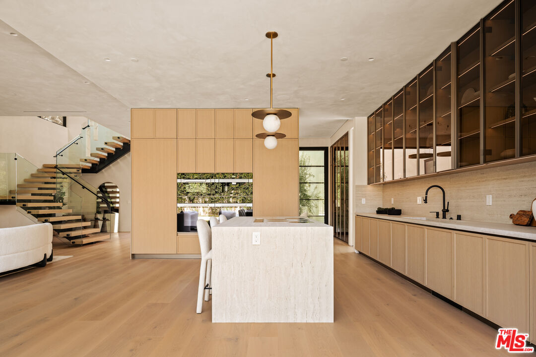 4718 Lemona Avenue Sherman Oaks, CA 91403 - Photo 17 of 40 a kitchen that has a sink a stove and a wooden floor