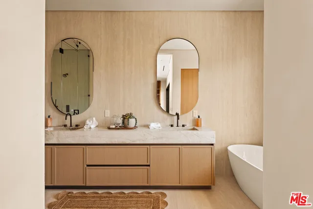a bathroom with a bathtub and a sink