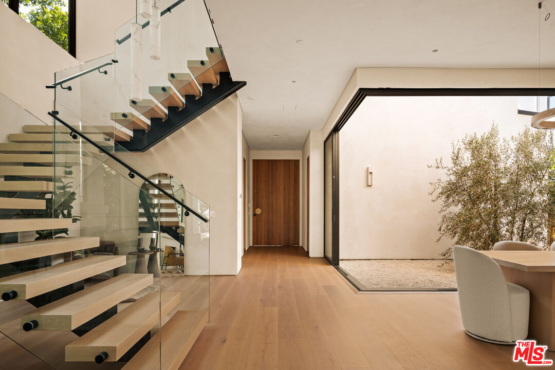 4718 Lemona Avenue Sherman Oaks, CA 91403 - Photo 3 of 40 a view of entryway and hall with wooden floor