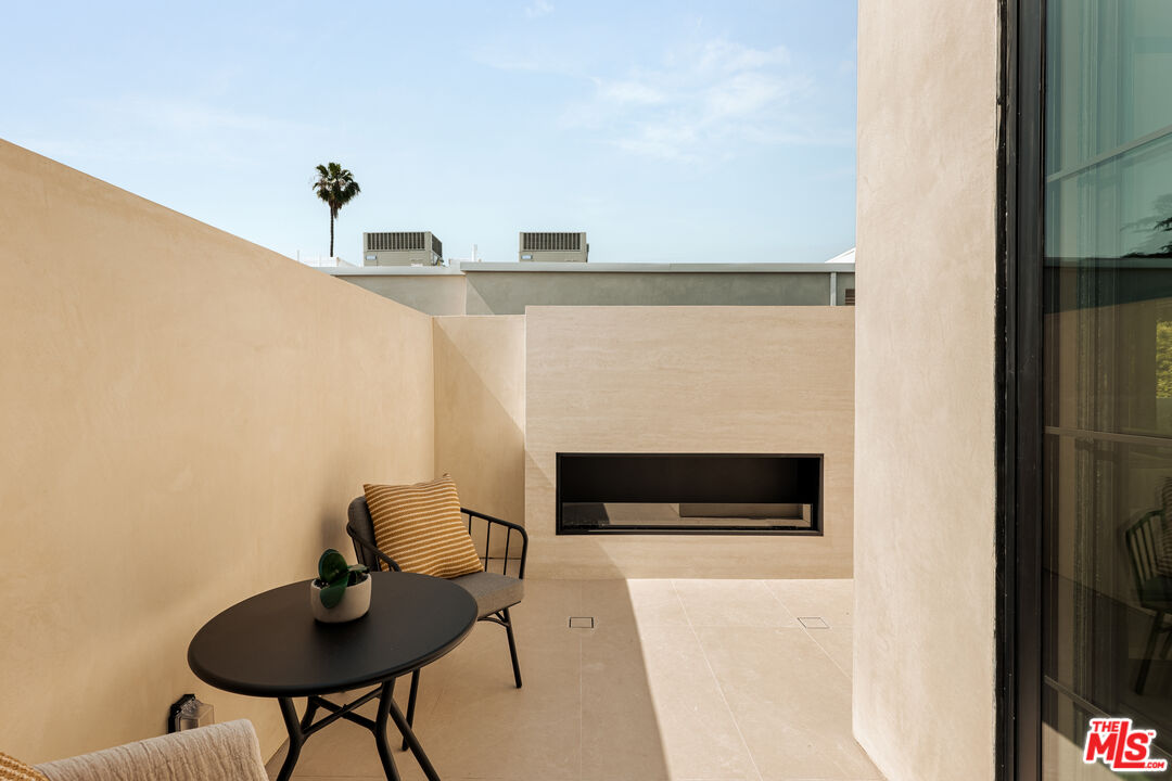4718 Lemona Avenue Sherman Oaks, CA 91403 - Photo 31 of 40 a living room with furniture and a fireplace