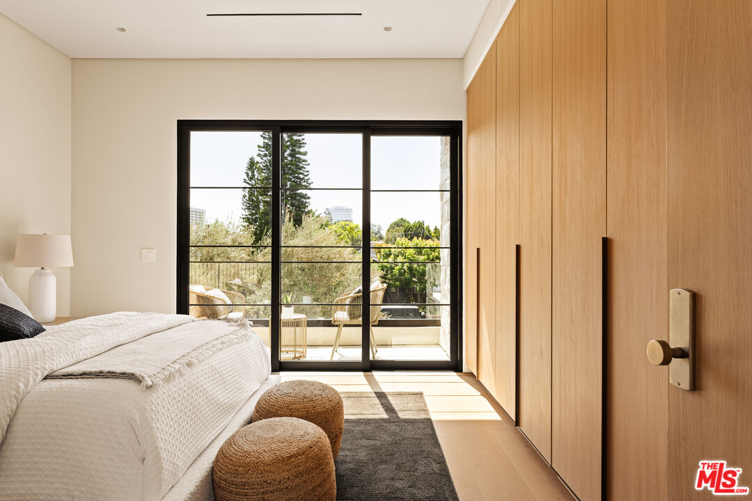 4718 Lemona Avenue Sherman Oaks, CA 91403 - Photo 33 of 40 a bedroom with a large bed and a large window