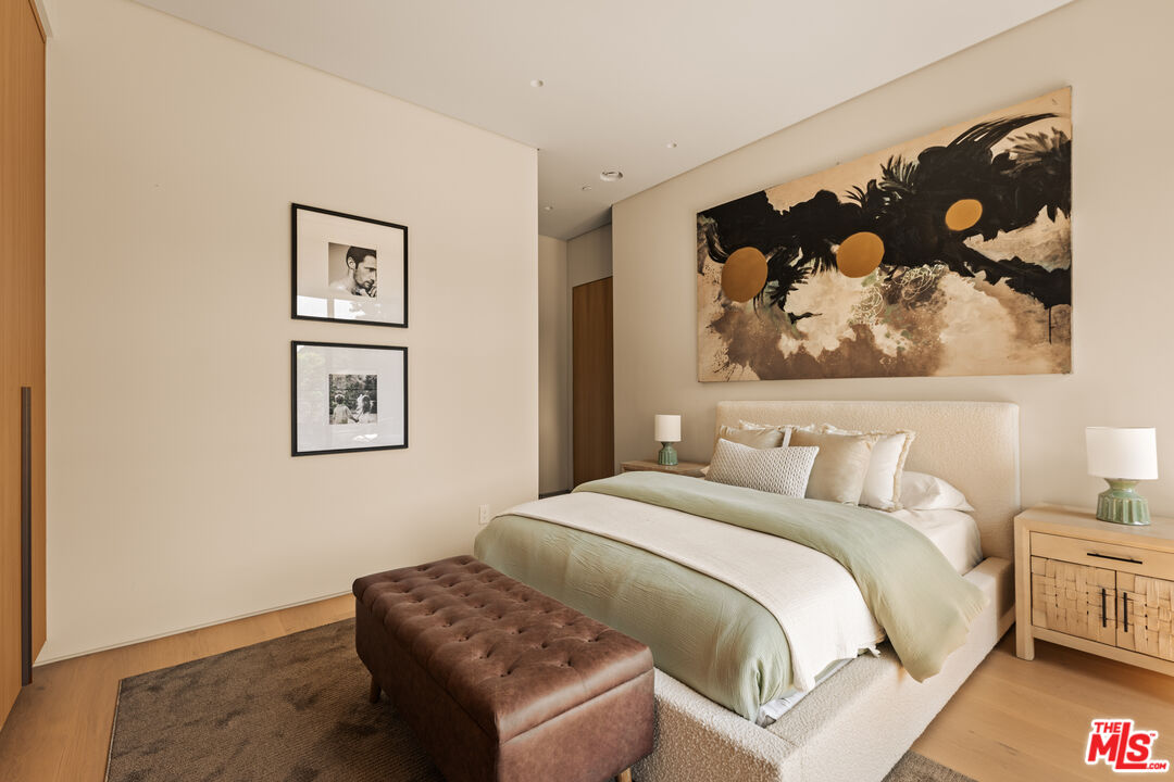 4718 Lemona Avenue Sherman Oaks, CA 91403 - Photo 36 of 40 a bedroom with a bed and wall painting