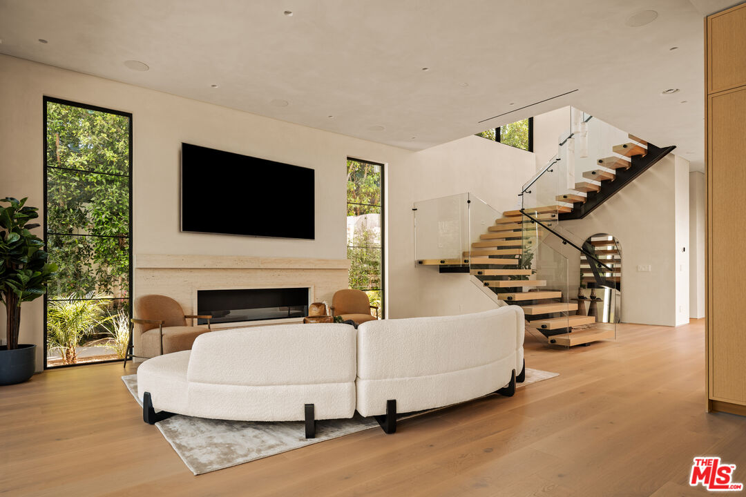 4718 Lemona Avenue Sherman Oaks, CA 91403 - Photo 7 of 40 a living room with furniture and a flat screen tv