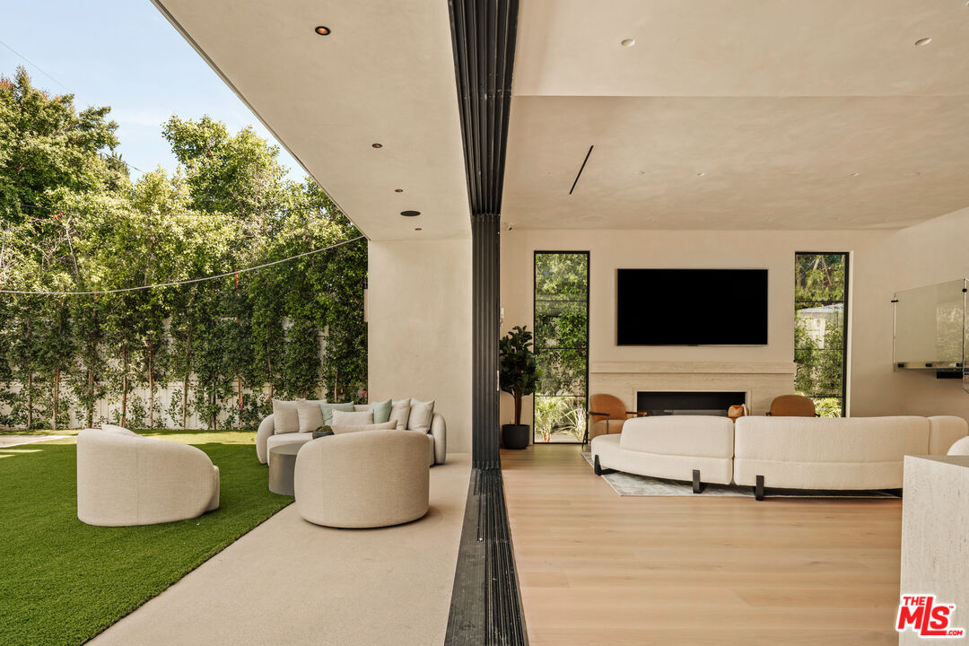 4718 Lemona Avenue Sherman Oaks, CA 91403 - Photo 9 of 40 a living room with furniture and a flat screen tv