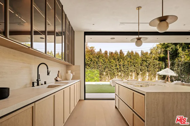 a bathroom with a sink and a large mirror