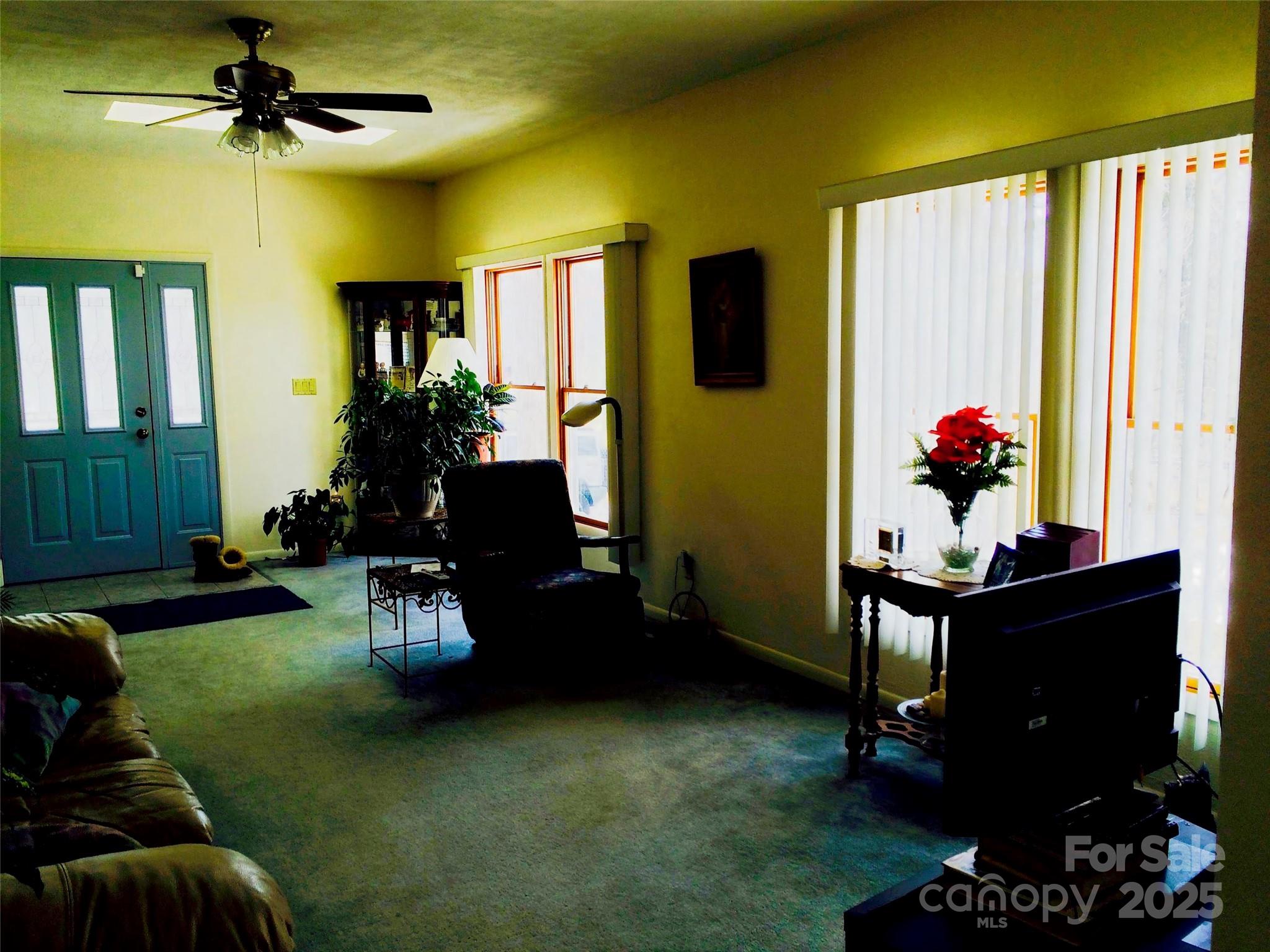 1270 Lilly Drive Clover, SC 29710 - Photo 6 of 8 a living room with furniture and a potted plant